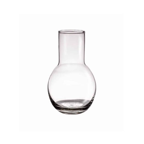 A clear, empty glass carafe with a round base and a narrow, cylindrical neck is centered on a white background.