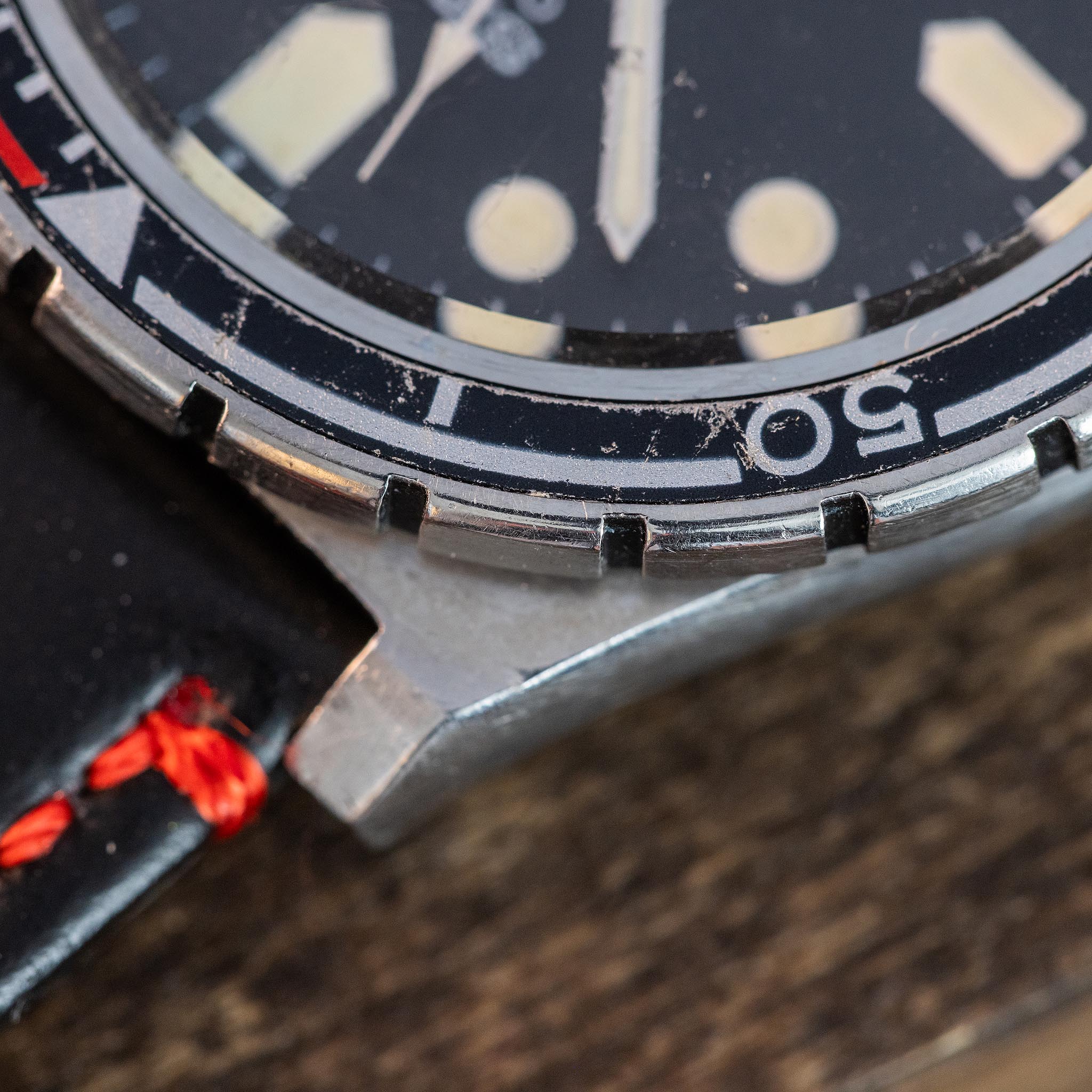 Macro view of the worn black-and-red rotating bezel on the 1979 Seiko SilverWave Z.