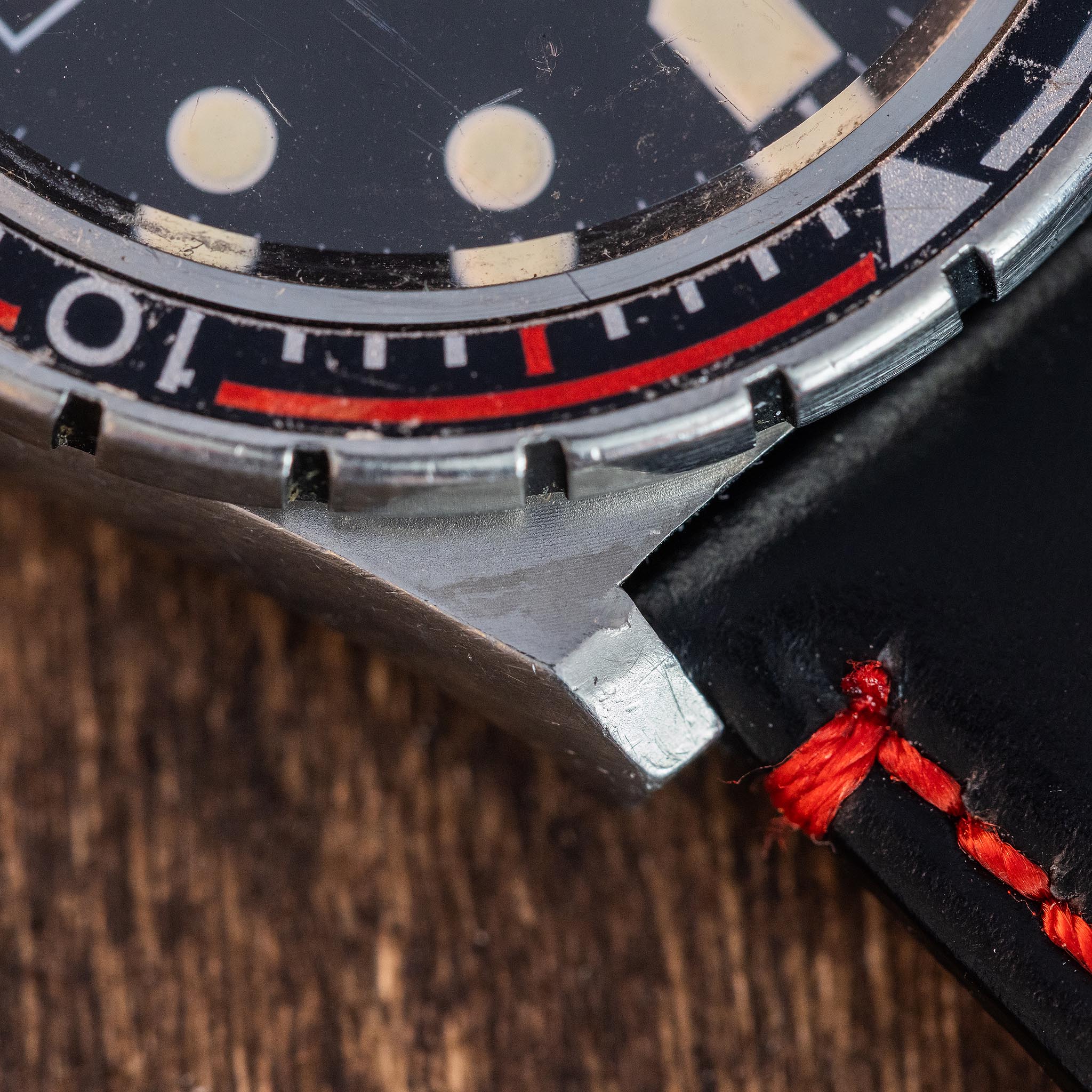 Detailed view of the Seiko SilverWave Z case and bezel showing honest vintage wear and the red bezel accent.