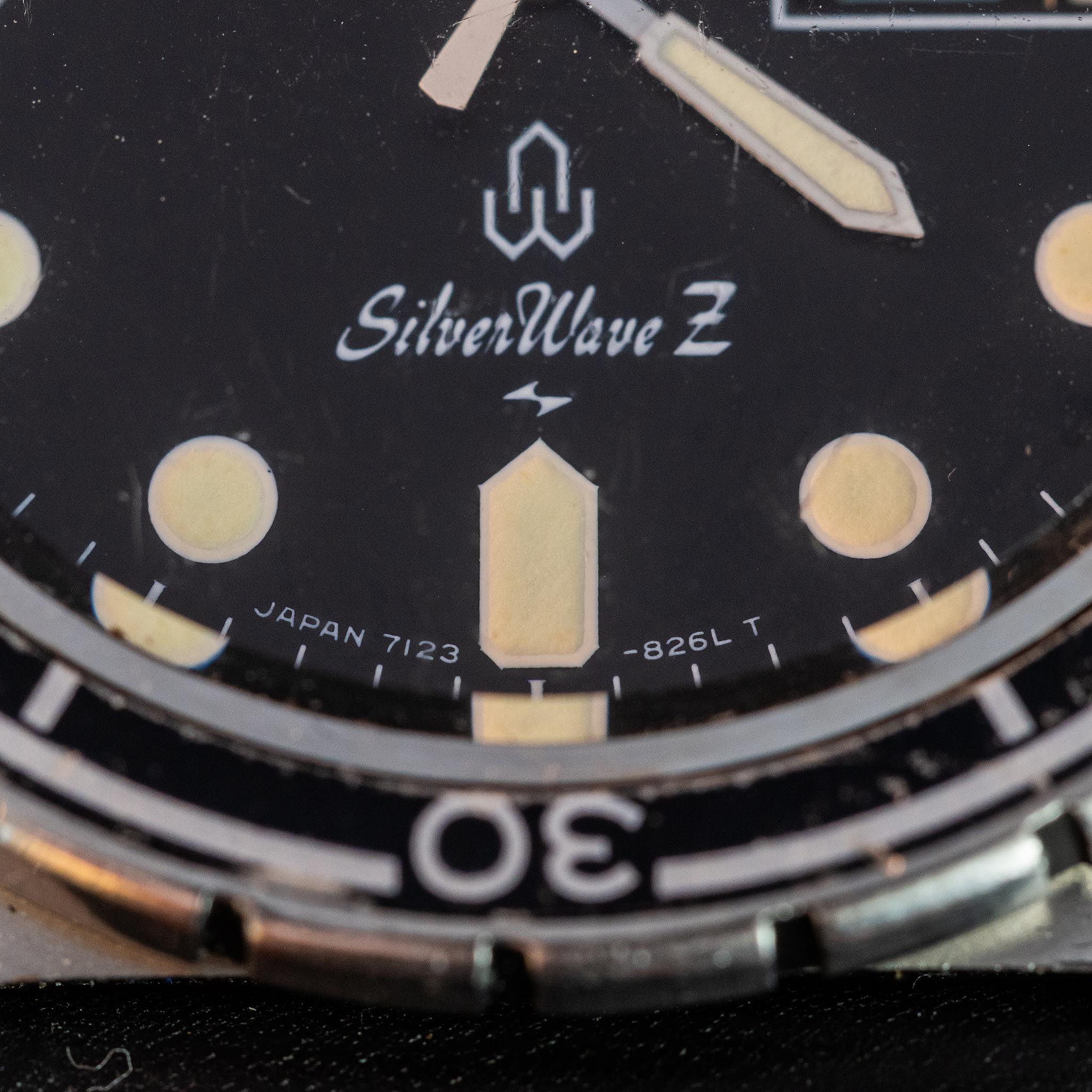 Macro photograph of the Seiko SilverWave Z black dial showing the lower dial code and period printing.
