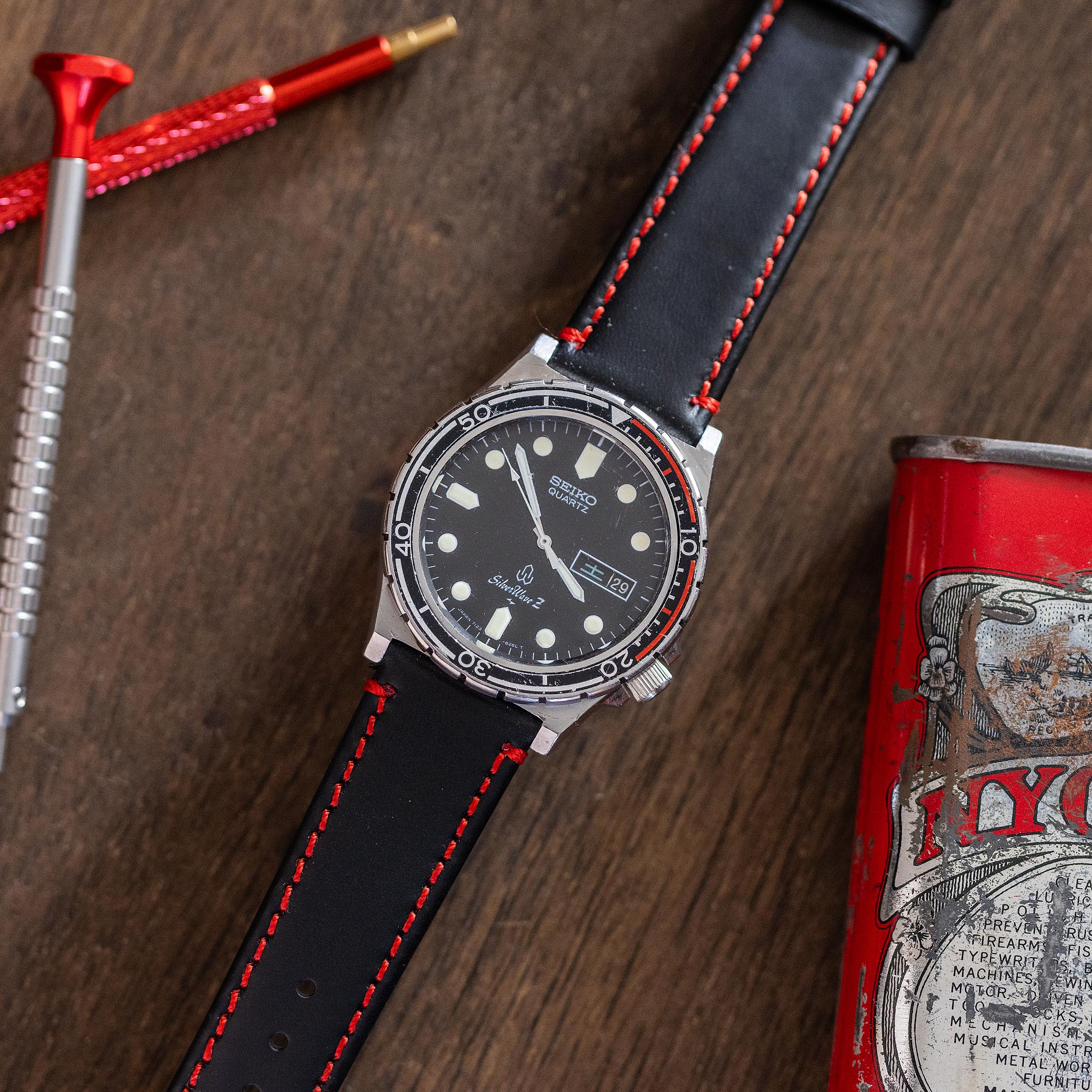 Restored Seiko SilverWave Z on a black leather strap with red stitching chosen to echo the red bezel accent.