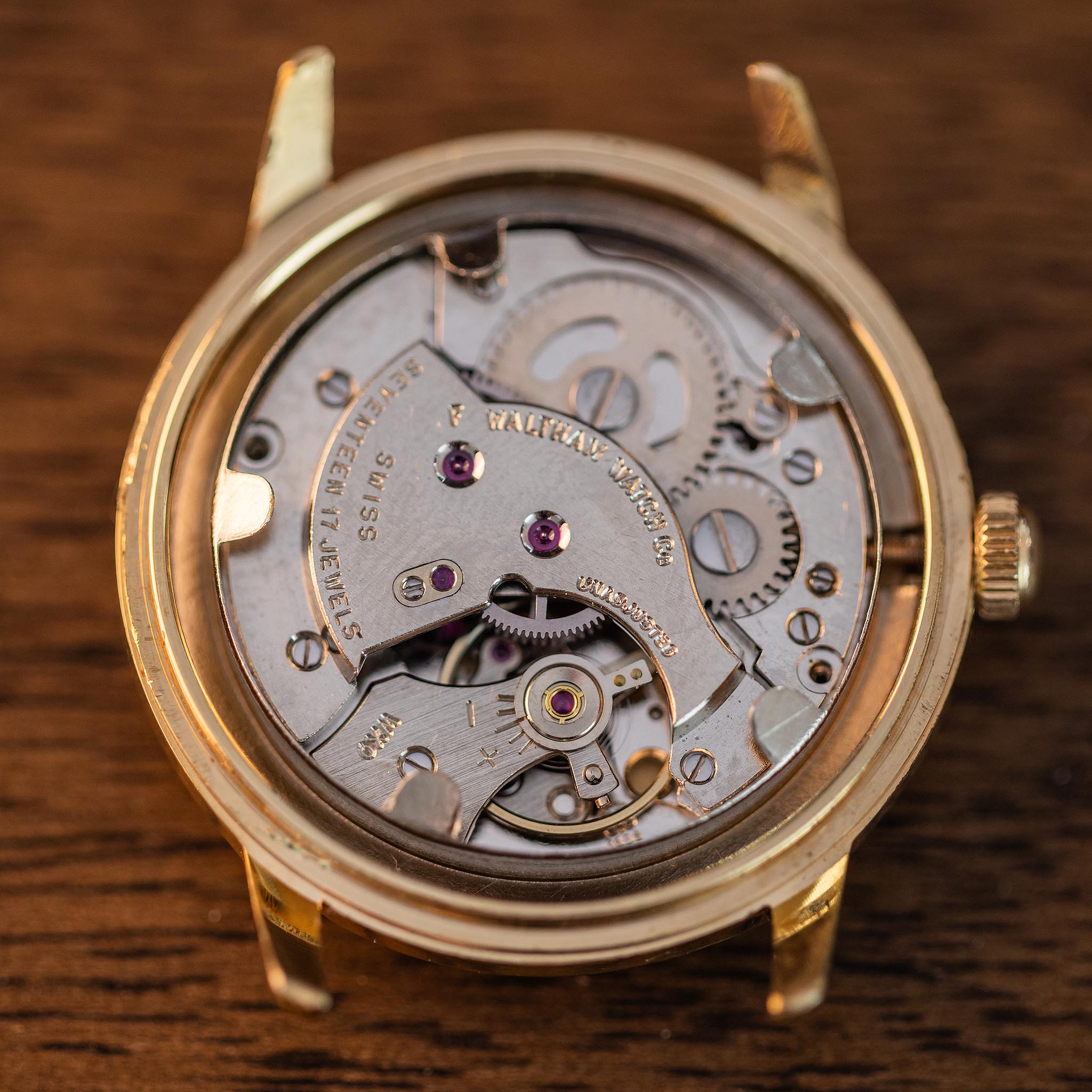 Open vintage Waltham wristwatch showing the complete Swiss 17-jewel manual-wind movement inside the case.
