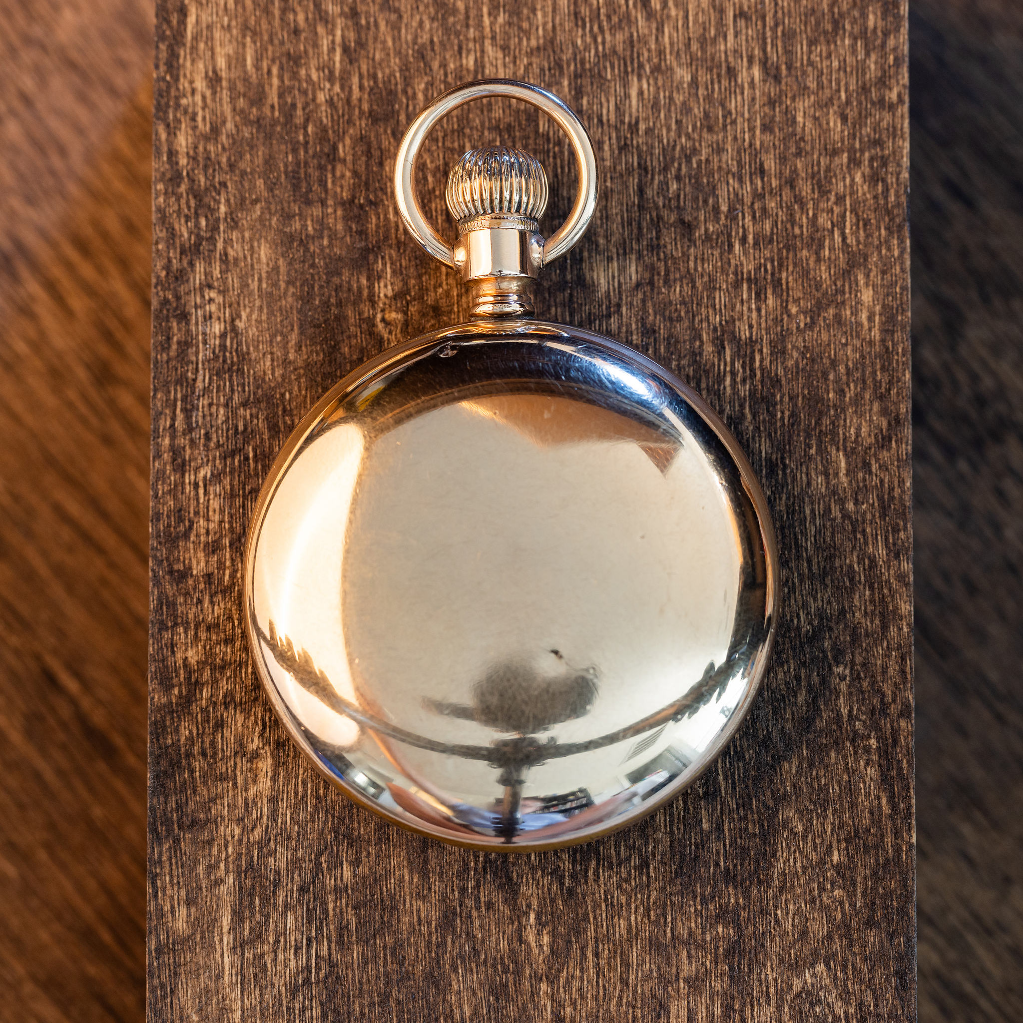 Smooth gold-filled back of Rockford Grade 918 pocket watch, with fine historic scratches and warm finish