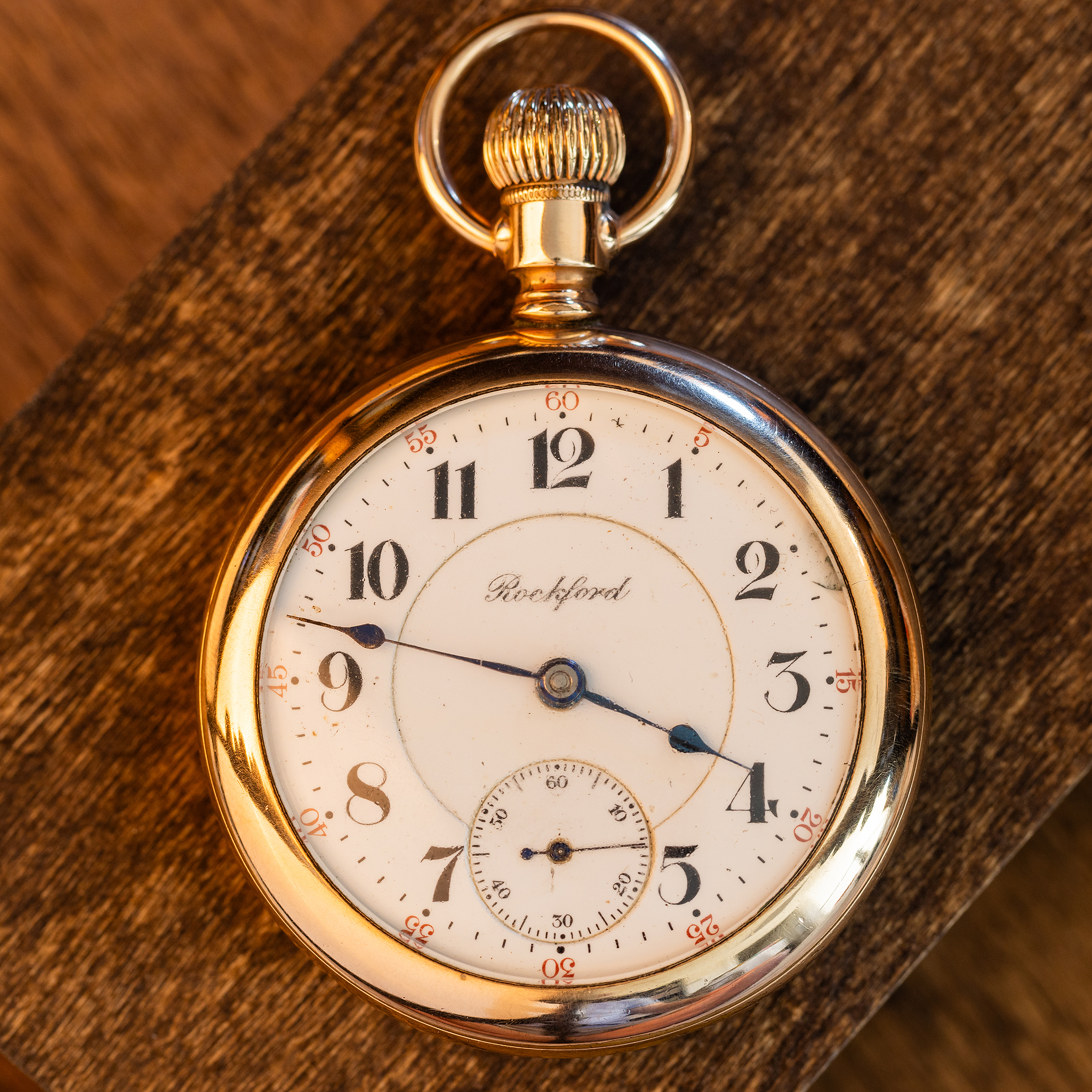 Inside the Fahys 14K gold-filled watch case showing 25-year warranty stamp and case serial 7116640.