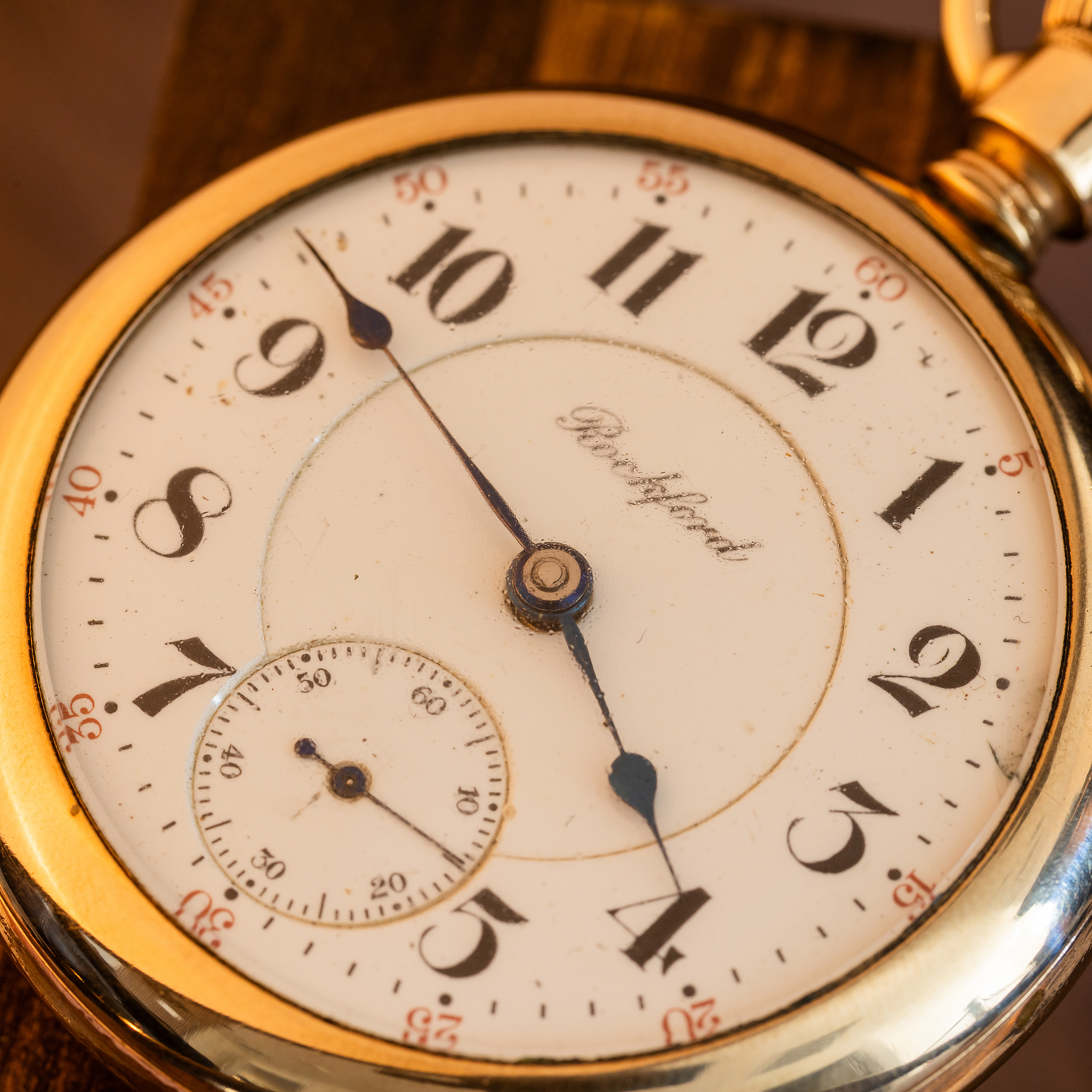 Detailed dial photo of Rockford Grade 918 pocket watch, blued steel pear-shaped hands and red five-minute timing track.